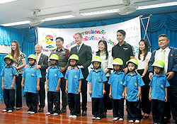 Children model their new helmets, donated by Sofitel Silom Bangkok