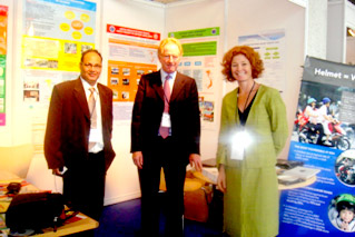 Lotte Brondum at the Vietnam Injury Prevention Partnership booth with Adrian Walsh, Director of RoadSafe, and Bikash Mohapatra, Secretary of the Gorum for Prevention of Road Accidents