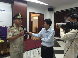 Long Thou of the Department of Traffic Police and Public Order is interviewed by Cambodian media on the topic of road safety in connection with his involvement in the meeting.