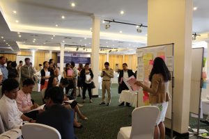 Stakeholders meet with each other during a breakout session of the strategy workshop.