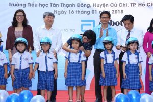 Students from Tan Thanh Dong Primary School receive new quality helmets as part of our Helmets for Families program. 