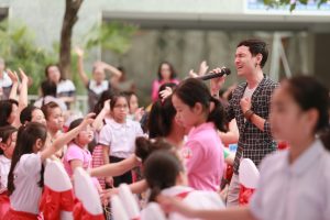 Musician Doan Nhuoc Quy performs theme song "The Precious" at the launch event in Hanoi.