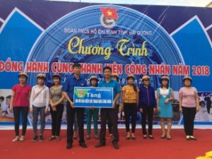 Workers in Lai Vu Industrial Zone receive helmets as a part of a road safety program