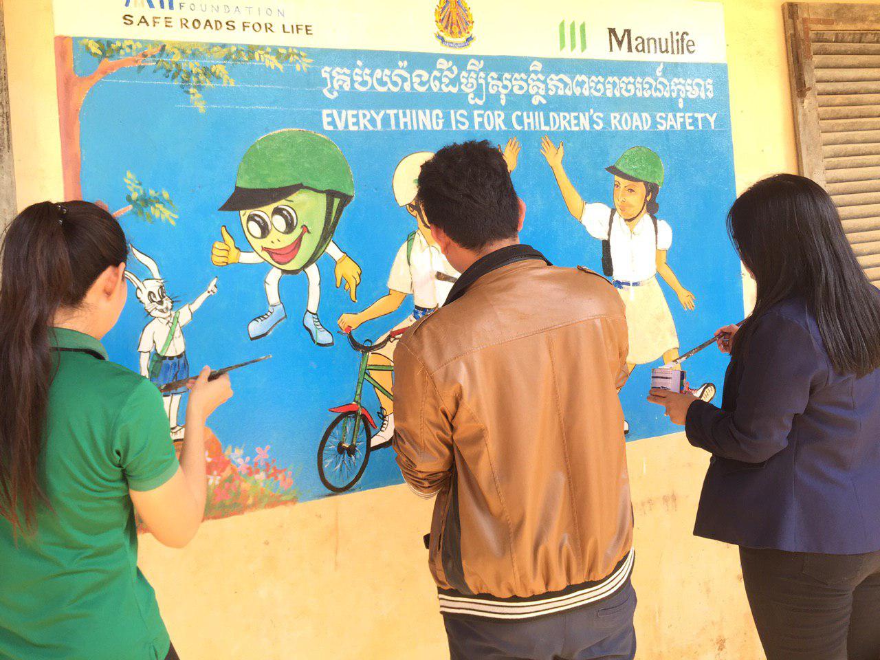 "Everything is for children's road safety" message painted on walls of school in Cambodia