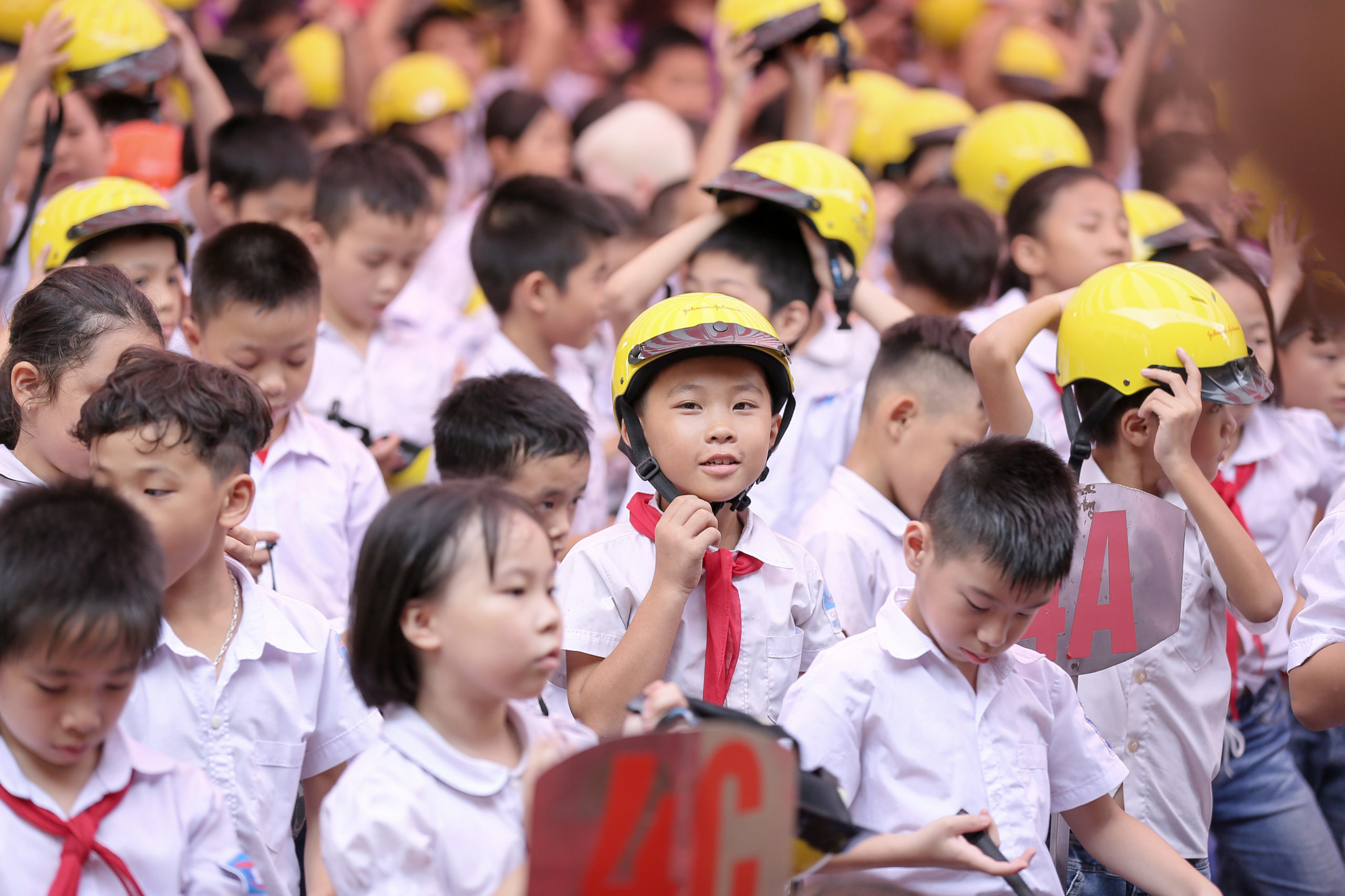 A student at a program school in Thai Nguyen, Vietnam wears his quality helmet provided through the Helmets for Kids program.